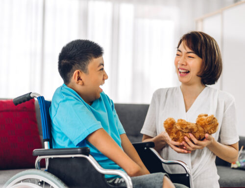 Portrait,Of,Asian,Physiotherapist,Carer,Helping,And,Playing,With,Special pediatric home healthcare services